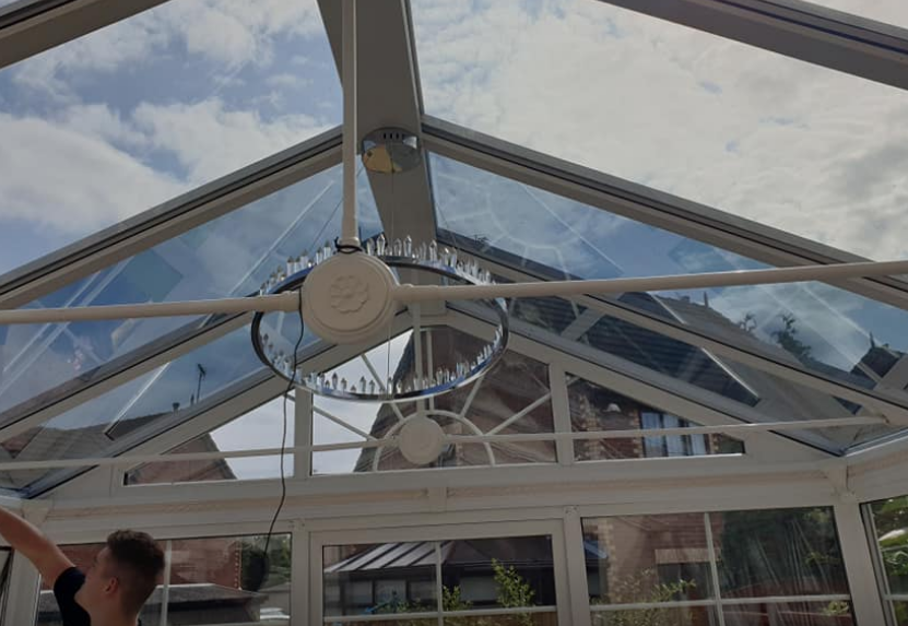 Conservatory with window film being fitted